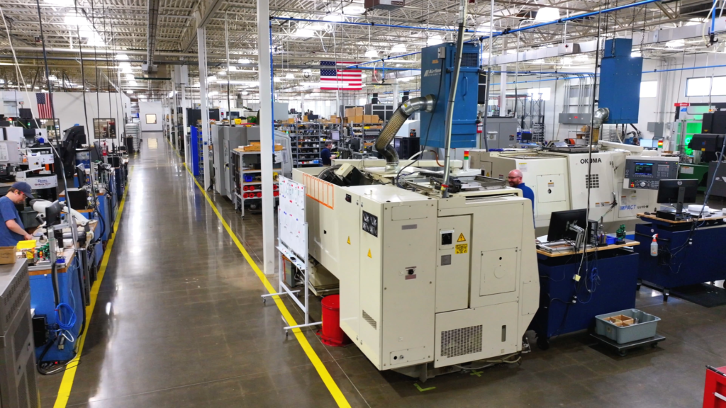 Industrial manufacturing facility with CNC machines, production equipment, and factory workspace