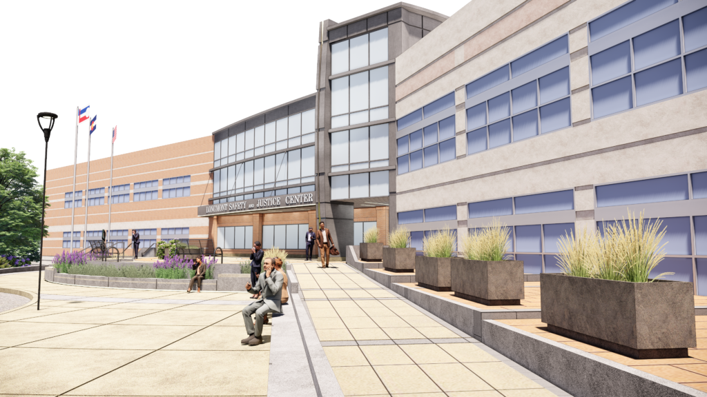 Exterior architectural rendering of the Longmont Safety and Justice Center showing the entrance plaza, landscaped areas, seating, and modern civic building façade