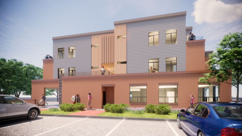 Modern commercial building exterior with brick facade, glass windows, balconies, landscaping, and parking area