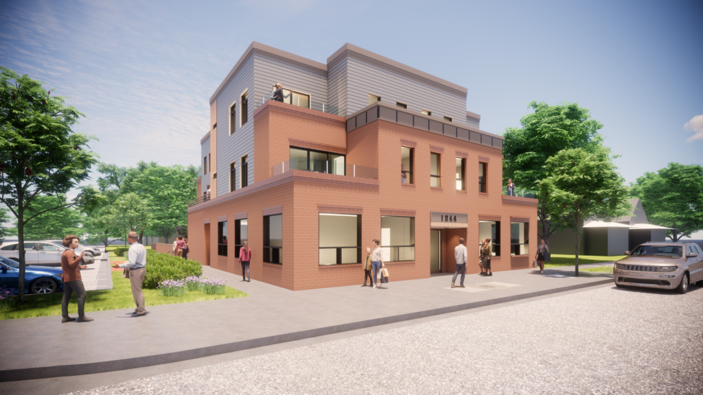 Modern three-story commercial building exterior with brick facade, large windows, balconies, and landscaped surroundings