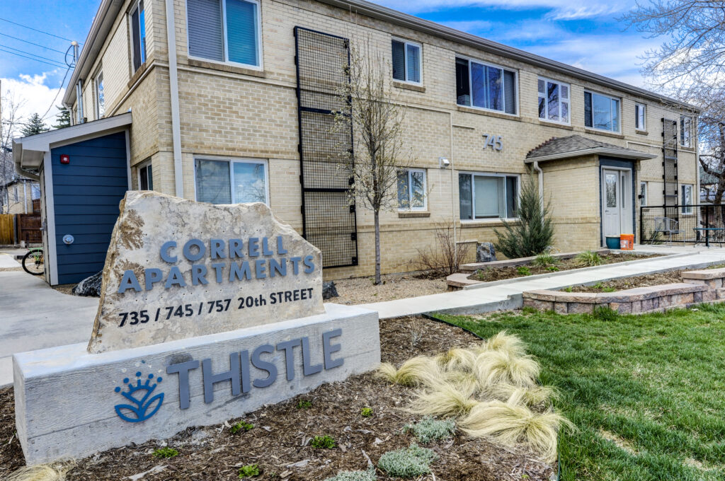 Correl Apartments exterior with brick building facade, landscaped entrance, and modern residential architecture