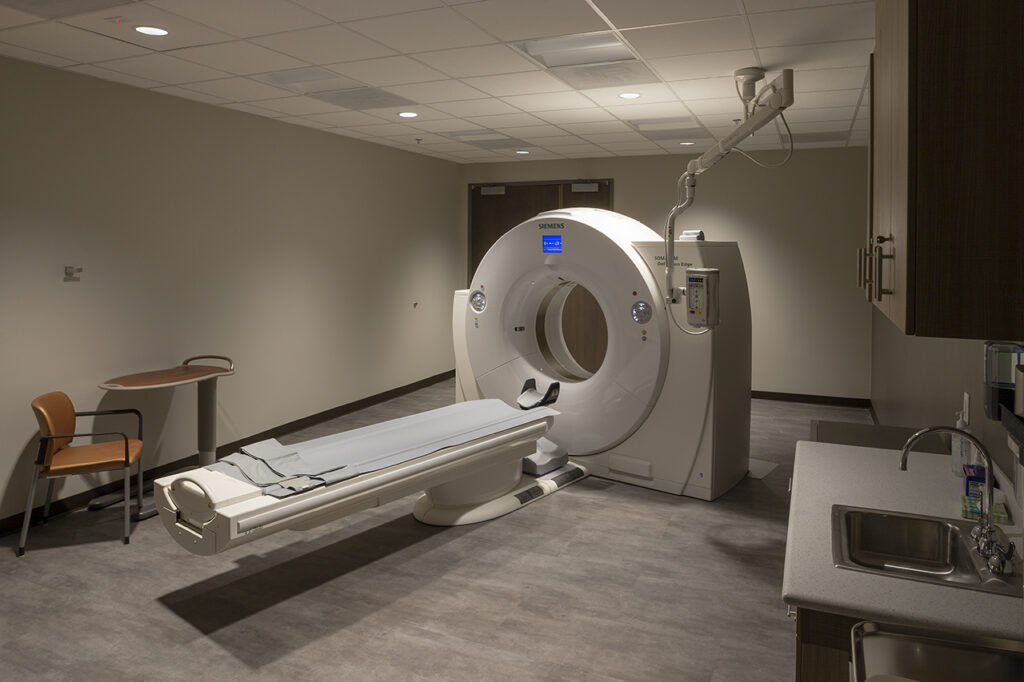 Modern CT scan imaging room with medical scanner equipment and healthcare interior design