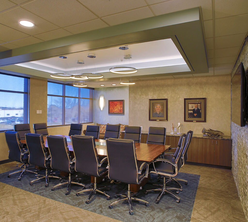 Modern healthcare conference room with meeting table, office chairs, and contemporary medical facility interior design