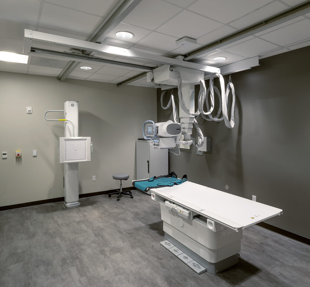 Modern medical imaging room with diagnostic equipment and contemporary healthcare facility interior design