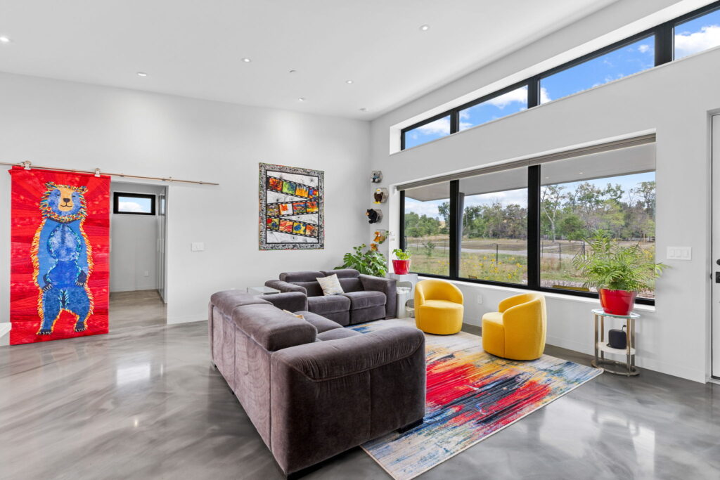 PEH Architects modern living room interior with large windows and contemporary furniture design