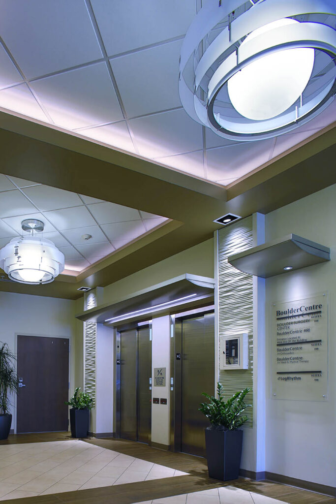 Modern medical office interior with elevator lobby, architectural lighting, and contemporary healthcare design elements