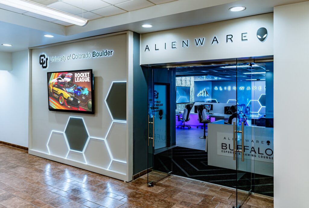 Modern Alienware esports gaming lounge with LED lighting, gaming stations, glass entrance, and futuristic interior design