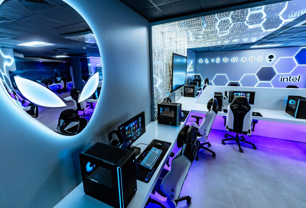 Futuristic Alienware esports gaming room with gaming PCs, chairs, LED lighting, and high-tech interior design